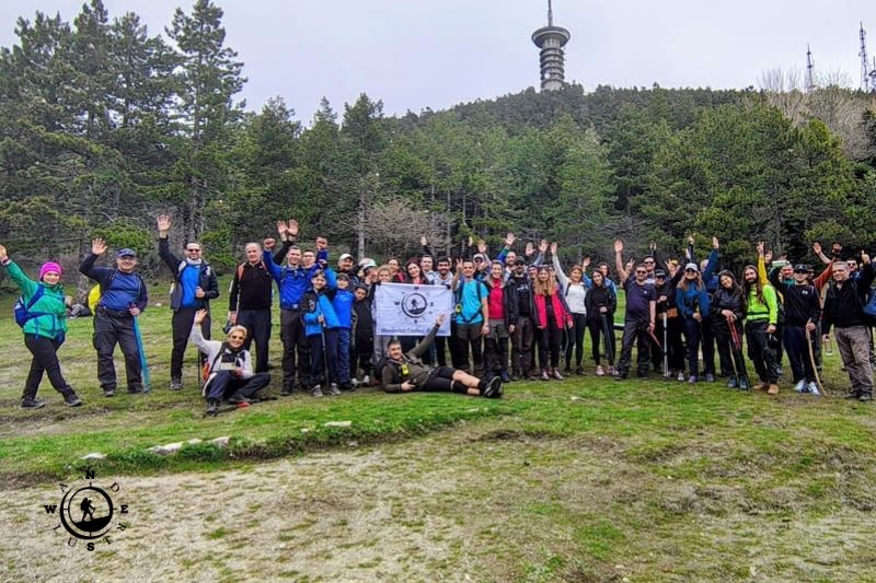 Group photo of hikers in a clearing on Mount Parnitha